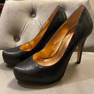 Black platform pumps